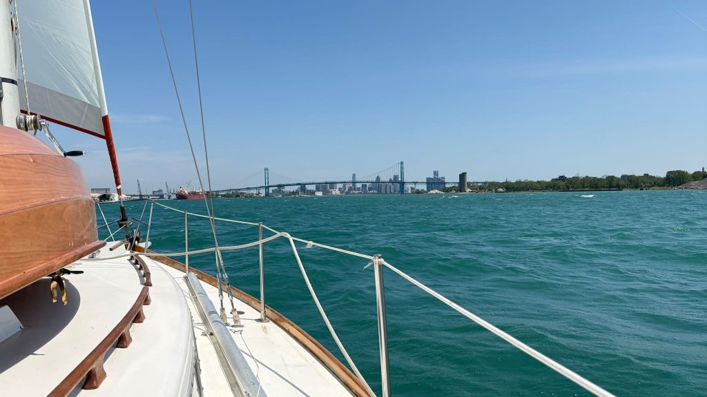 A view of the Detroit River from the deck of Altair.  The Ambassador Bridge and the Detroit skyline is visible ahead.